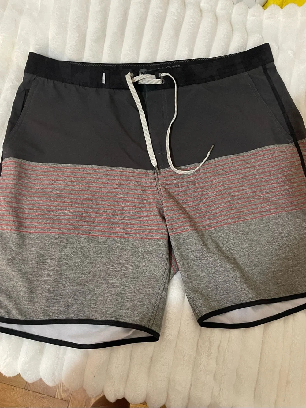 Vuori Men's Swim Shorts in Black with Dusty Rose Accent